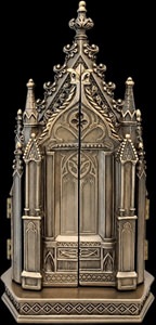Lukket triptykon i bronzefinish – ligner en miniaturekatedral på en bogreol